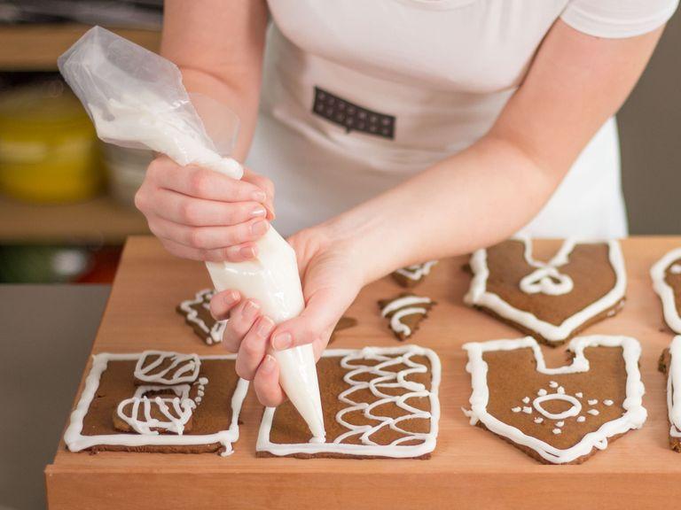 Meanwhile, mix confectioner’s sugar with just enough water to form a thick icing. Once pieces have cooled, decorate with icing using a piping bag. If desired, decorate with sprinkles or other edible decorations. Set aside to dry completely.