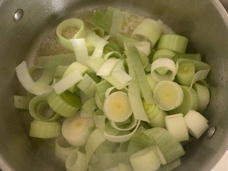 Add in your washed leek, mix and leave to cook on medium-low heat 