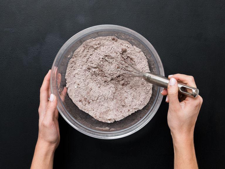 Add flour, cocoa powder, baking powder, and salt to a bowl and stir to combine.