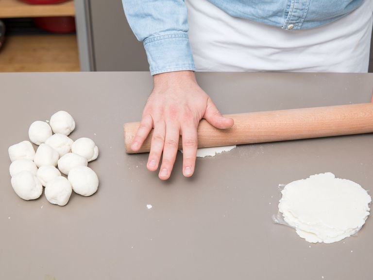 Grab two flat surfaces (such as cutting boards) to flatten the tortillas, or use a rolling pin. Stack your tortillas with plastic wrap in between so they don’t stick together.
