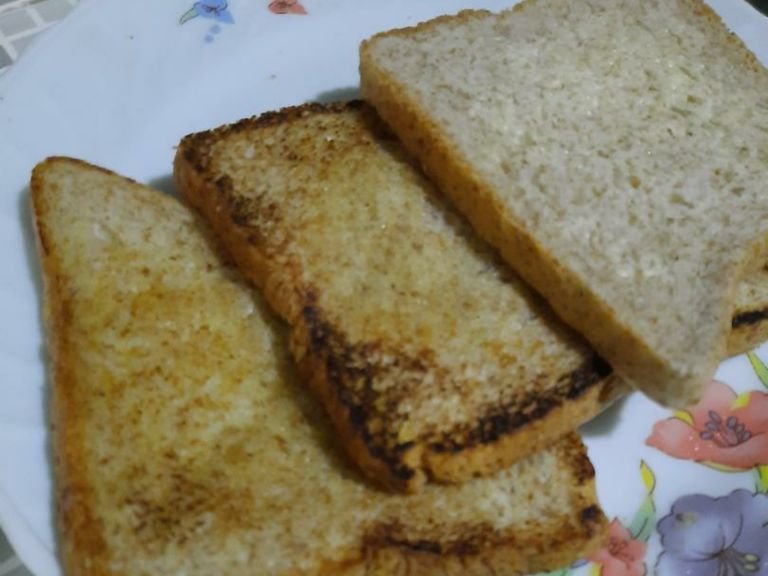 Apply margarine into each side of wheat bread and bake