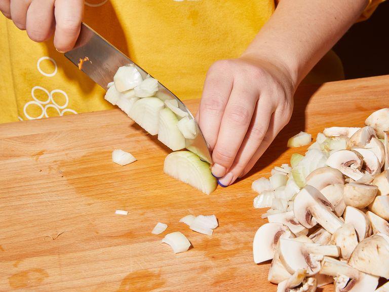 Peel onion, garlic, carrots and potatoes. Finely mince the garlic and dice the rest into approx. 1-cm/ ¼-in-thick cubes. Trim celery stems, and dice into the same size. Clean the mushrooms, then quarter them.