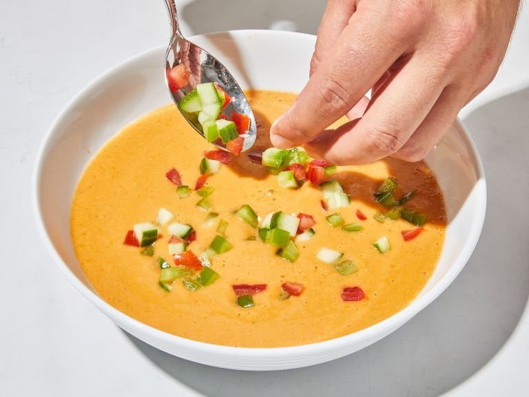 Season cold gazpacho to taste with more salt and pepper. Add gazpacho to your serving bowls (or cups) and add reserved, finely chopped vegetables on top. Finish with croutons, a drizzle of olive oil and, if desired, fresh basil, parsley, and dill. Enjoy!