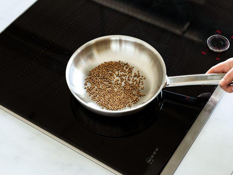 Toast sesame seeds in a small pan and set aside, then toast coriander seeds.