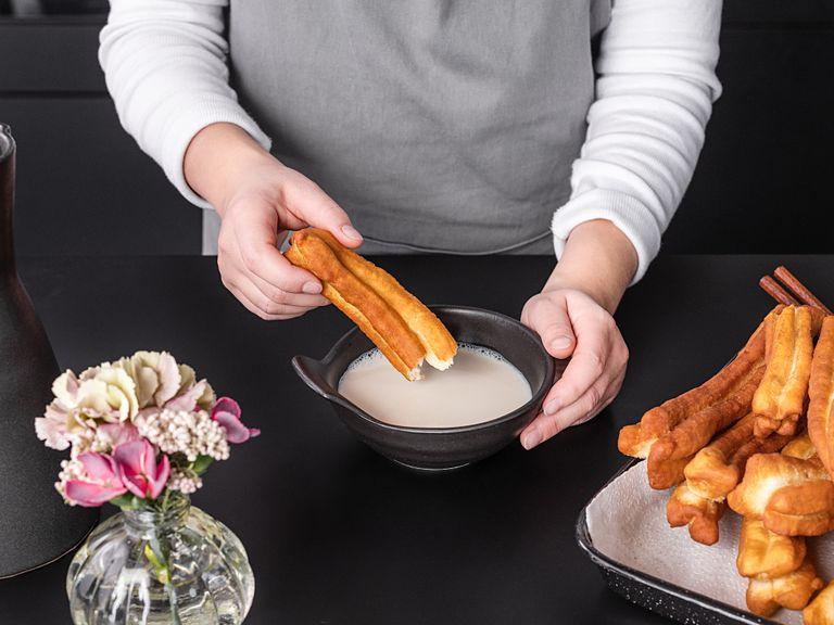 Once golden brown all over, remove to a paper towel-lined plate. Repeat with all the dough sticks. Serve youtiao with soy milk, for dipping, Enjoy!