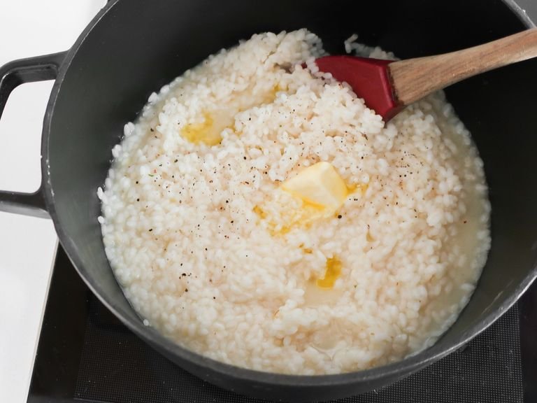 Add butter, Parmesan, remaining lemon zest, and stir through until combined, adding extra stock to loosen the mixture if needed. Serve risotto with asparagus strewn over the top, and stir in wild garlic oil. Garnish with mint if desired. Enjoy!