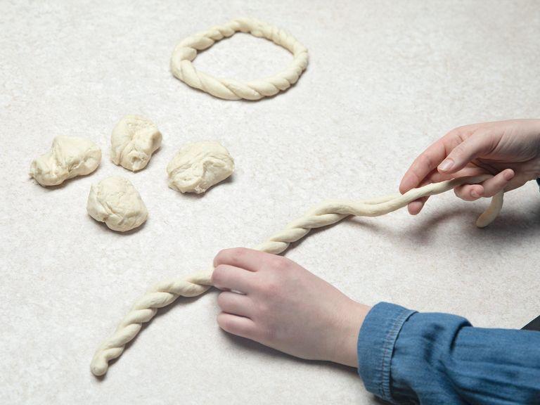 Divide dough into 16 pieces and roll into long, thin strands. Gently braid two strands around each other, then form into a circle and press the ends together firmly.