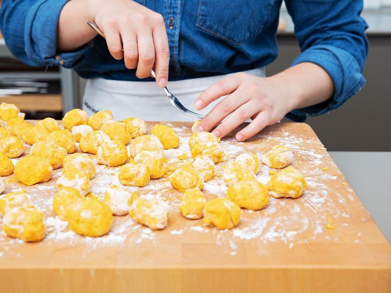 Flour a clean working surface, add some dough and roll into a log. Repeat with remaining dough. Cut into bite-sized pieces and roll into small balls. To create the classic gnocchi indentations, roll each gnocchi over the tines of a fork, then transfer onto a floured baking sheet.