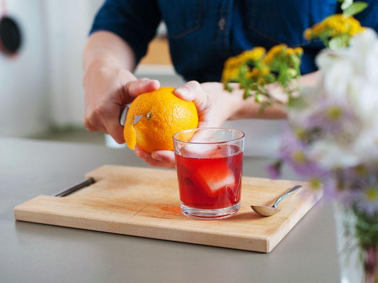 Cut an orange peel, rub it gently around the rim of glass, then use it as garnish. Enjoy!