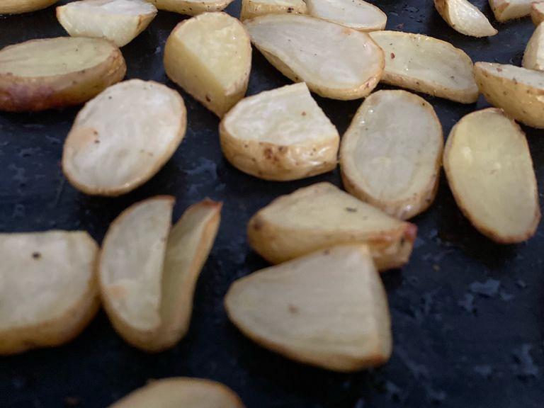 Take potatoes out of the oven when they are golden brown. This may sometimes take a little longer than 30 min., depending on the type and thickness of the potatoes.
