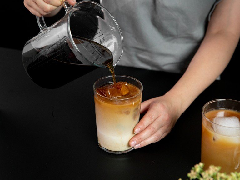 For cold brew ice cubes, add most of the cold brew to ice cube trays and freeze until solid. Add cold brew ice cubes, milk, and some extra cold brew to a glass and enjoy.