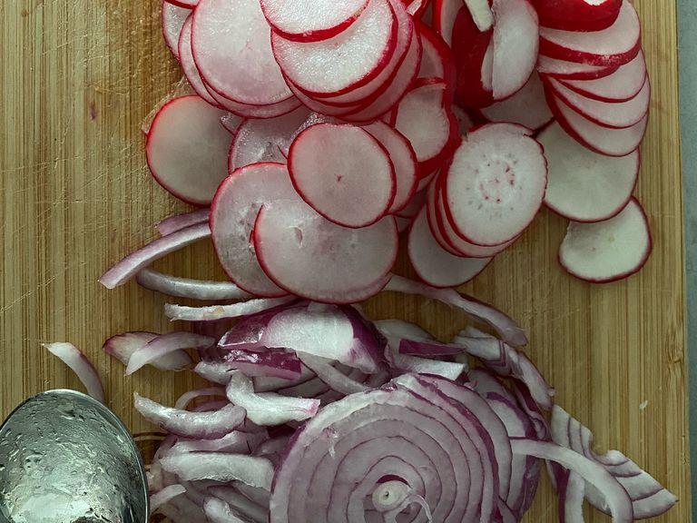 Thinly slice onion and radishes.