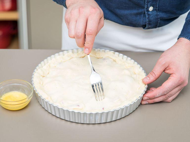 Roll out the second half of the dough, and place on top of the pie. Fold in the edges and gently press to seal. Now take a fork to prick the top of the pie. Whisk egg yolk, then brush across the pie. Bake for approx. 40 min. at 200°C/390°F. Cool down, and enjoy!