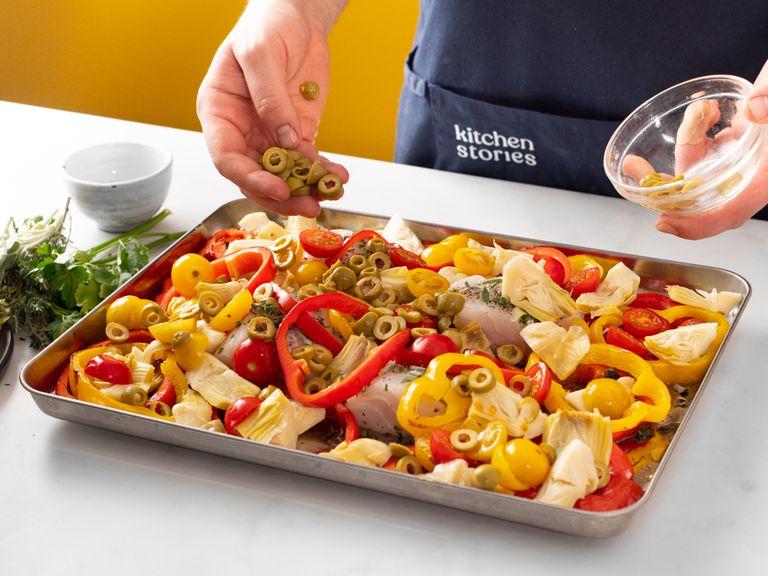 Once peppers are roasted, add cod to the baking tray and drizzle with more olive oil. Then add artichoke hearts, tomatoes, and olives. Increase oven temperature to 250ºC/480°F and roast for approx. 5 - 6 min., or until cooked through.