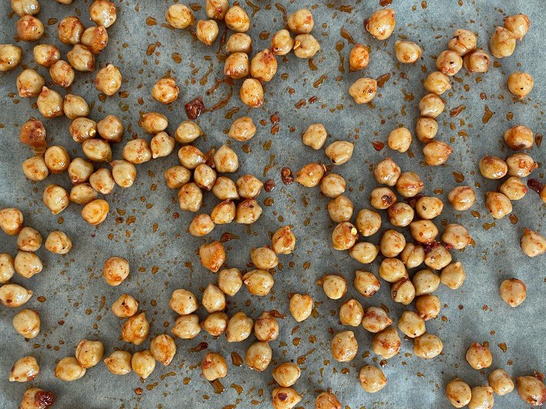 Get some pre-boiled chickpeas and season them with a bit of oil, sweet paprika powder, chili flakes, salt and pepper. Place them on a tray and bake at 180 degrees for 30 minutes