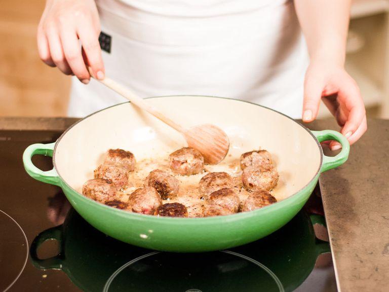 Melt butter in a large frying pan and brown meatballs from all sides for approx. 15 – 20 min. over medium heat. Make sure that the pan is not overcrowded. Remove cooked meatballs from the pan and set aside.