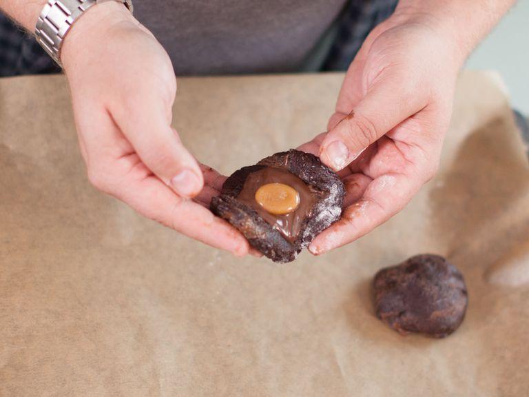 Form one tbsp dough into golf ball-sized shapes and then flatten into cookies. Place some hazelnut spread and a caramel candy into each cookie and seal edges. Place cookies on a lined baking sheet, sprinkle with fleur de sel, and bake in preheated oven at 180°C/350°F for approx. 8 – 12 min.
