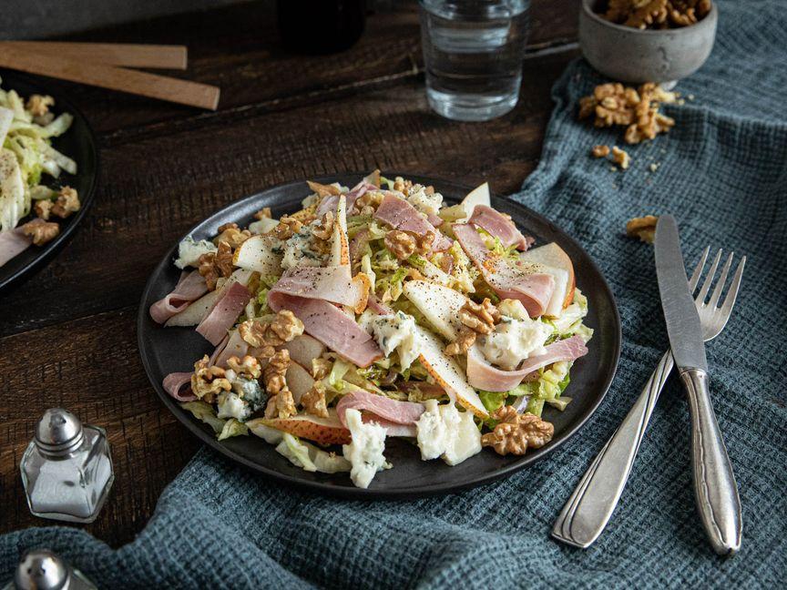 Savoy cabbage salad with pears, walnuts, and ham
