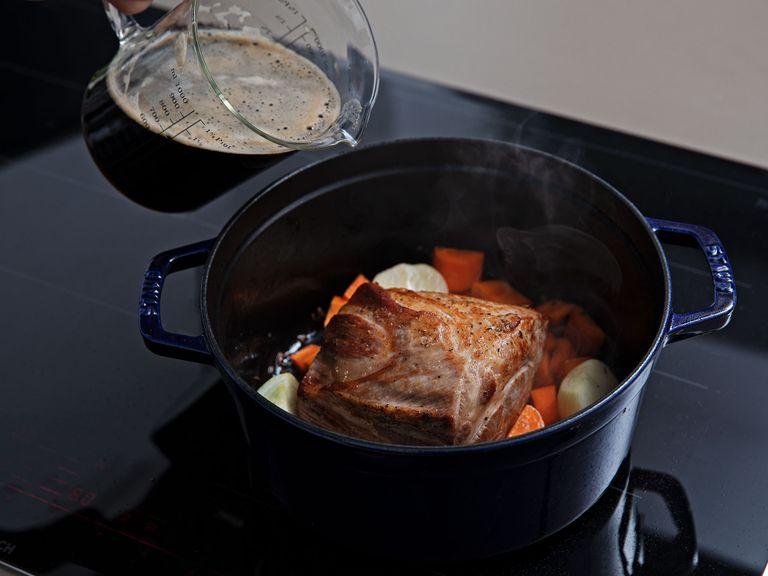 Heat a large pot over medium-high heat. Add vegetable oil, then sear the pork shoulder on all sides, approx. 2 min. per side. Add the cumin seeds, vegetables, and dark beers. Bring to a simmer, then cover and transfer to the oven.