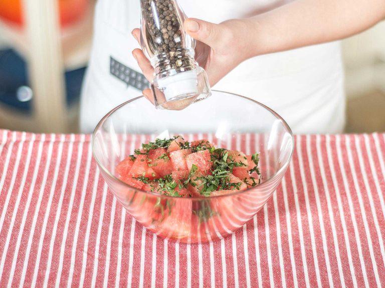 Place the cut watermelon and mint into a large bowl and season with lime juice, olive oil, sugar, salt, and pepper.