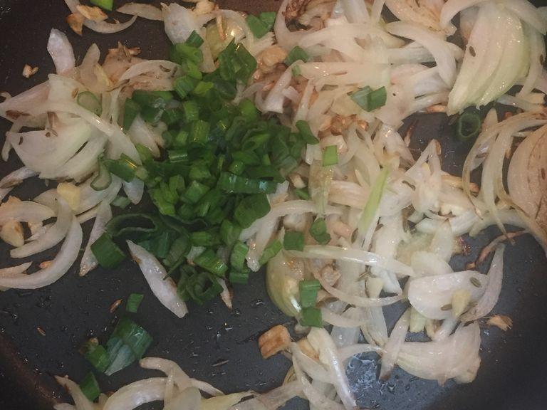Add olive oil when it’s get heated add the fennel seeds,onion,onion leaves,ginger and garlic slices and fry it until everything changed into light brown colors.