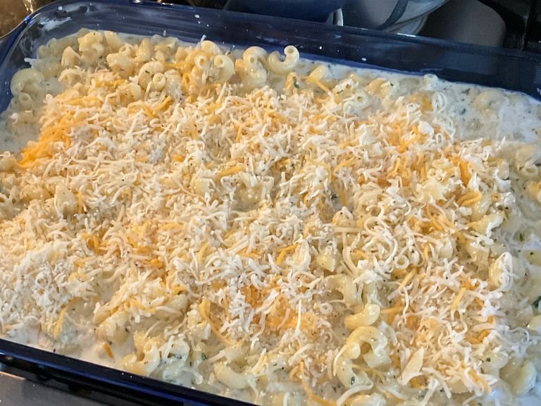 Place macaroni mix into the baking pan. Spread the rest of the cheese evenly on top of the macaroni.￼