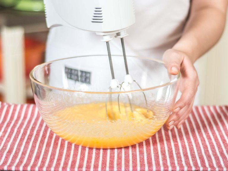 Beat sugar, eggs, egg yolks, and salt in a large bowl with a mixer or whisk.