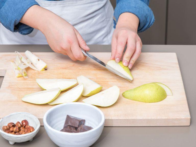 Preheat the oven to 190°C/375°F. Line the springform pan with parchment paper and grease the edges with olive oil. Quarter and core the pears, then slice each quarter into three. Roughly chop hazelnuts. Zest the whole lemon and set this aside.