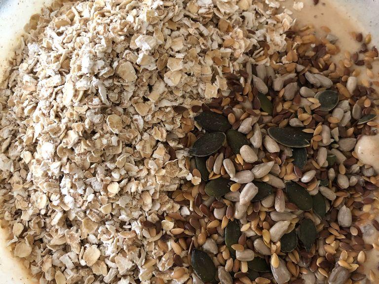 Then mix in the oats and either chopped mixed nuts or mixed seeds.