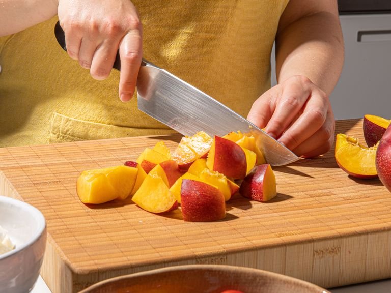 Quarter nectarines, remove and sicard pits, then cut each quarter in half widthwise. Cut halloumi into a large dice, halve cherry tomatoes, and tear bread into bite-size pieces. Zest and juice lemon. Add tomatoes, nectarines, lemon juice and zest to a large bowl. Add a pinch of salt and pepper and mix to combine. Set aside.