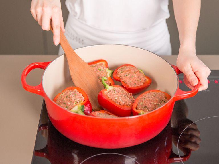 Stuff halved peppers with ground beef mixture and sauté in a frying pan for approx. 2 – 3 min. on all sides.
