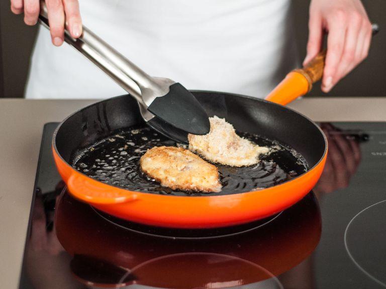 In a large frying pan, sauté chicken in some vegetable oil over medium heat for approx. 2 - 3 min. per side until golden. Set aside.