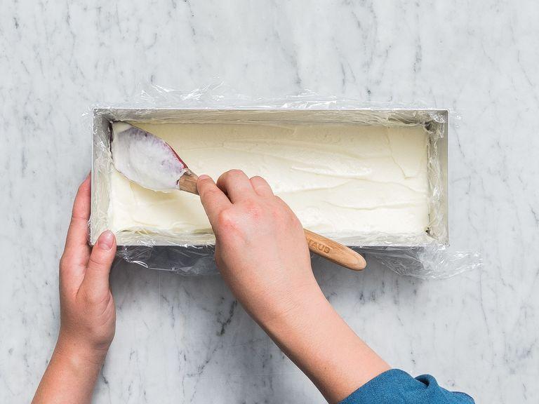 Remove the sponge cake base from the silicone baking mat and cut out two pieces according to the length your loaf pan. Add plastic wrap to the loaf pan and transfer one sponge cake base to the pan. Spread half of the mascarpone cream on top and refrigerate.