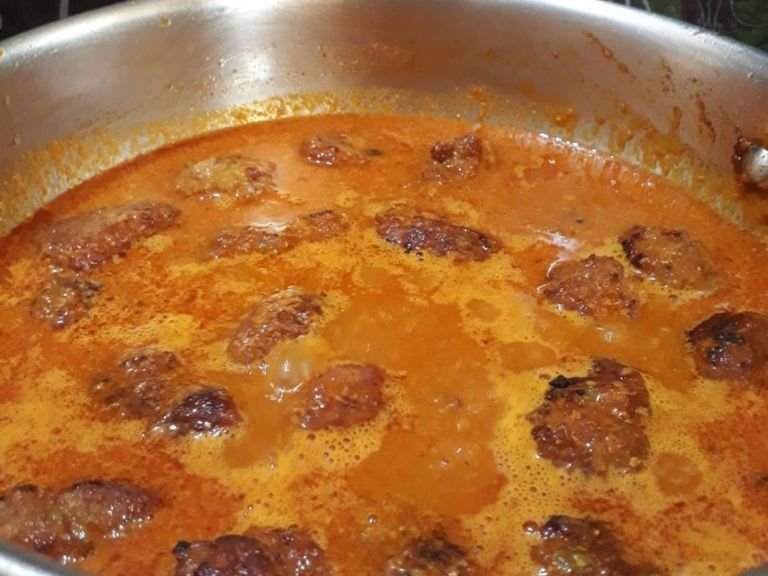 Now add kofta balls ome by one and close the lid till cooked completely can stir occasionally..