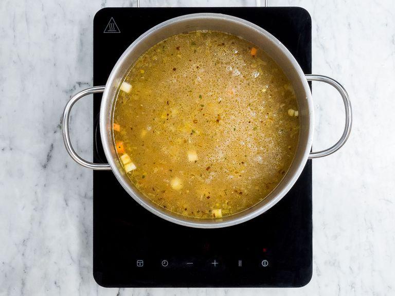 Add vegetable broth, salt, and chickpeas and let simmer on medium-low heat for approx. 1 hr., or until chickpeas are soft. Remove one ladle of chickpeas and cooking liquid, transfer into a small pot, and set aside. Drain half of the cooking liquid from the large pot and set aside.