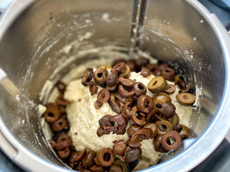 Mix in the olives and knead the dough until fully combined. 