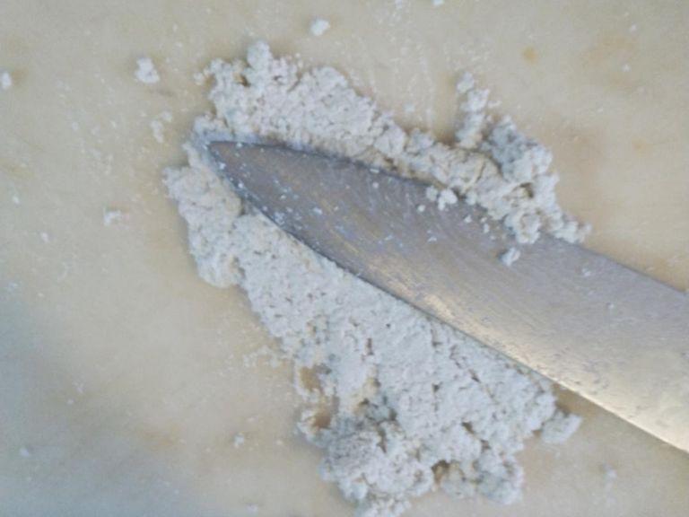 Drain the tofu. Finely chop the tofu until it is paste like, then 'mash' with the side of the knife to make a tofu paste. Add the barberries, hoisin sauce, some freshly grated nutmeg and chilli flakes.