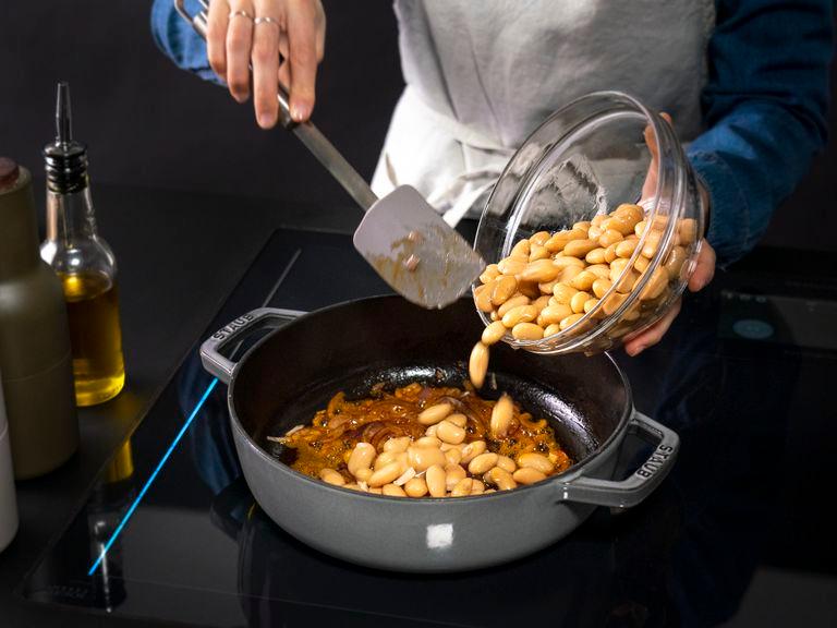 Add beans, season with salt and pepper, and let cook for approx. 2 min. Add tomatoes and about ½ can’s worth of water, being sure to scrape the bottom of the pan. Bring it to a boil and then lower the heat to maintain a simmer. Cover and let cook for approx. 15 min.
